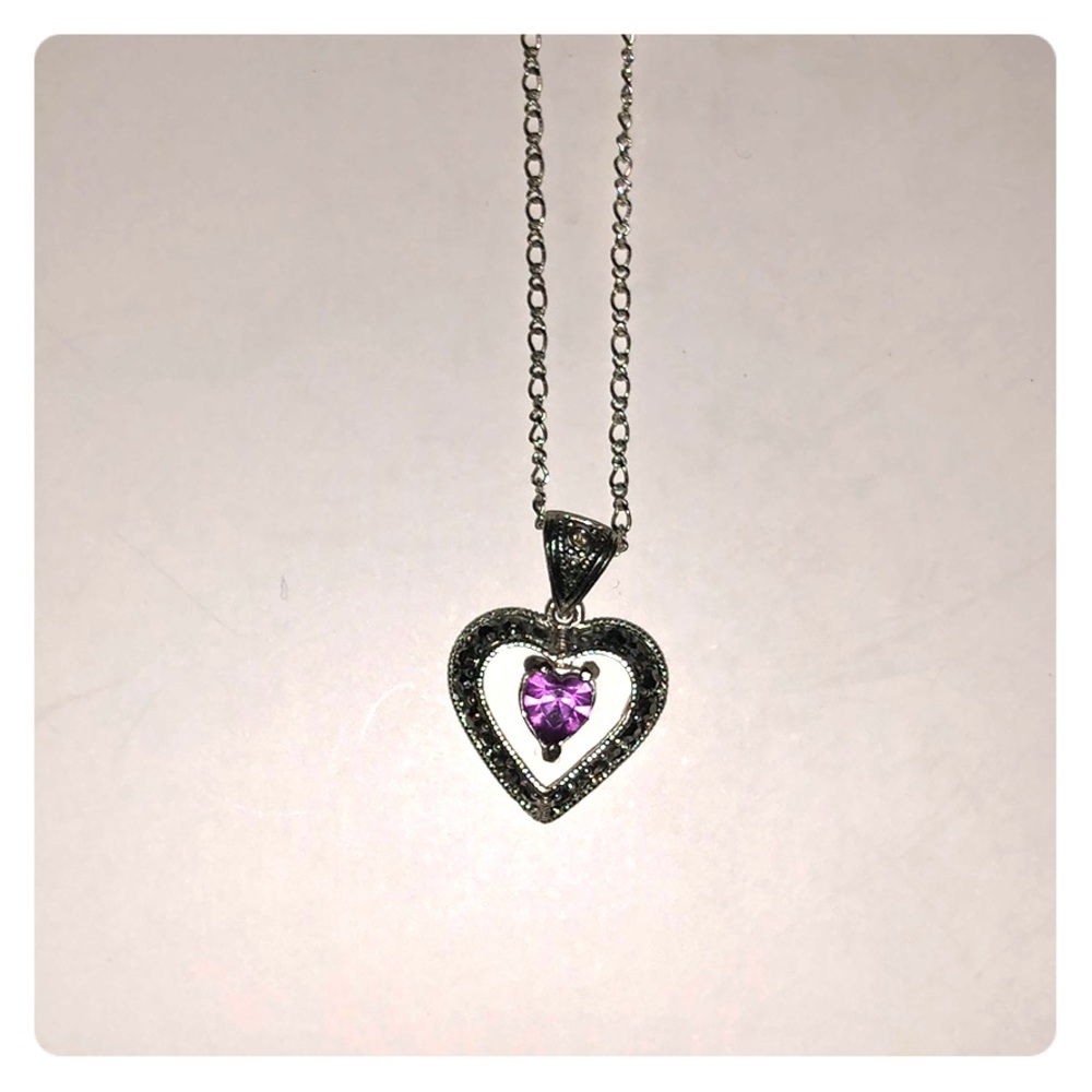 Silver necklace with purple stone